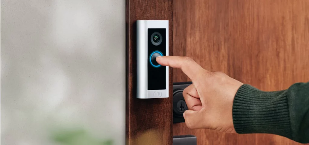 finger pressing doorbell