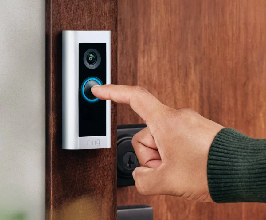 finger pressing doorbell